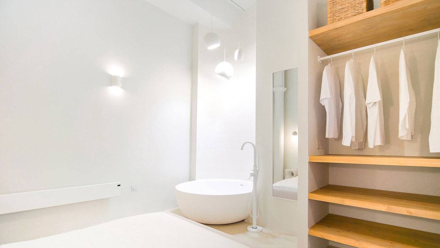 Modern bathroom with wooden shelves and a sink.
