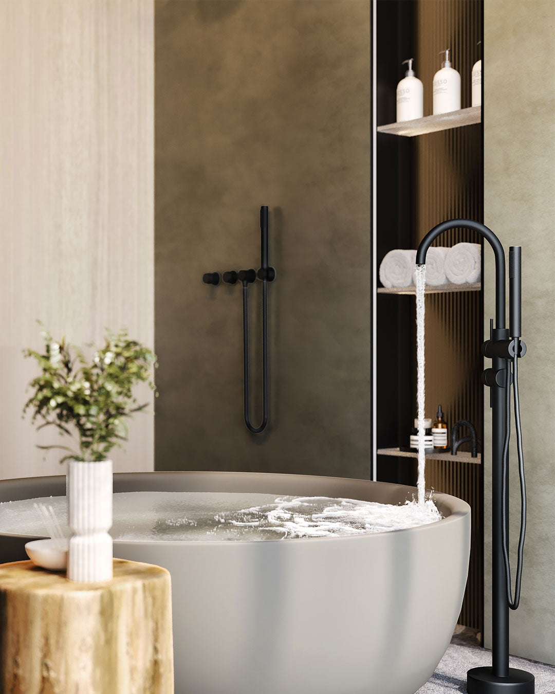 Modern bathroom with a freestanding bathtub, black fixtures, and a shelf with toiletries.