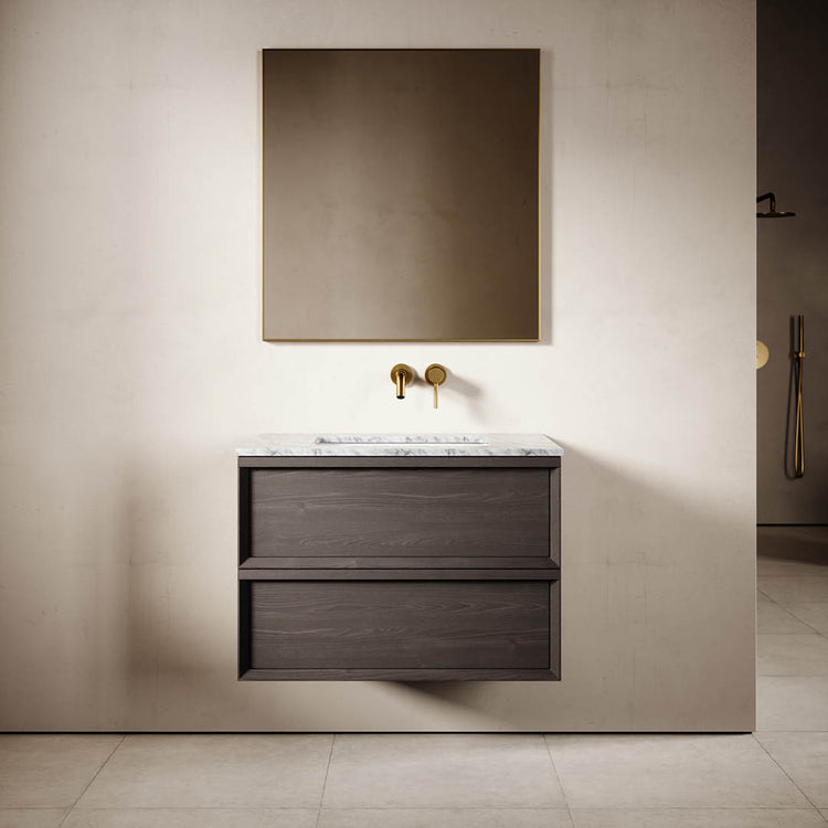 Bathroom vanity with mirror and faucet against a beige wall.