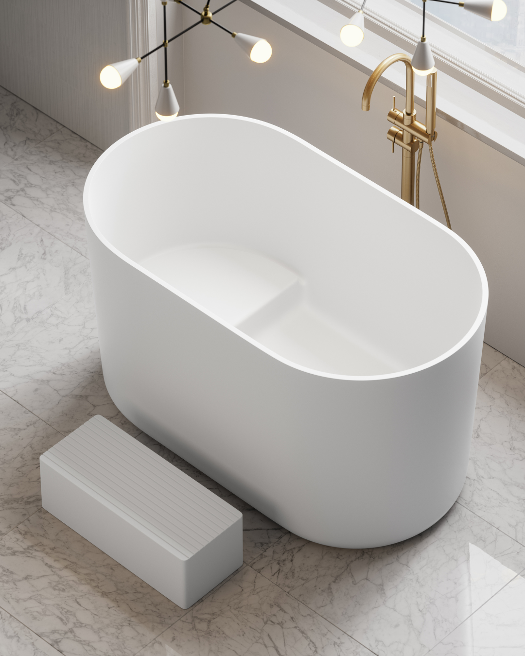 Modern freestanding bathtub in a stylish bathroom with marble floor and gold fixtures.