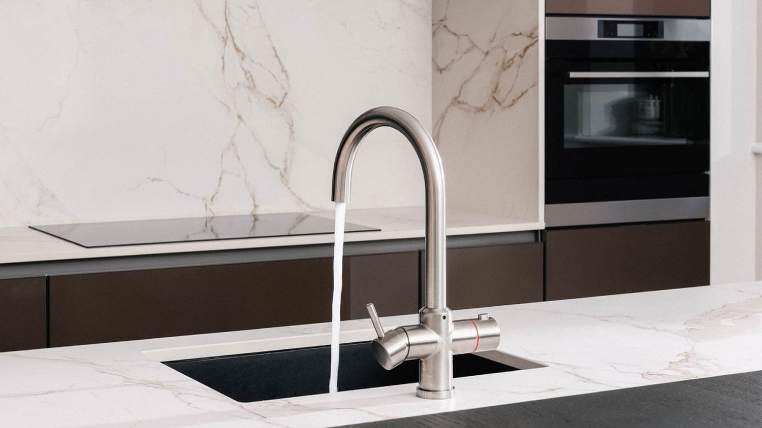 Modern kitchen sink with a faucet in a stylish kitchen setting.