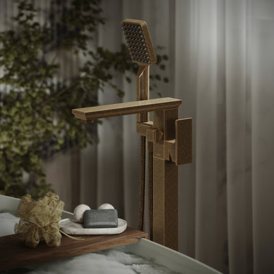 Wooden shower head and faucet set in a bathroom setting with plants in the background.