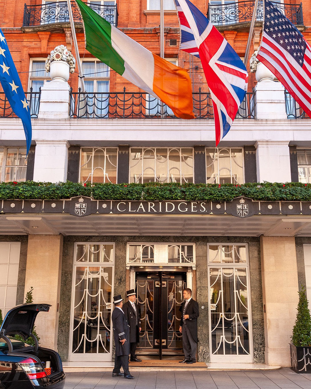 Claridges hotel entrance with flags above the door