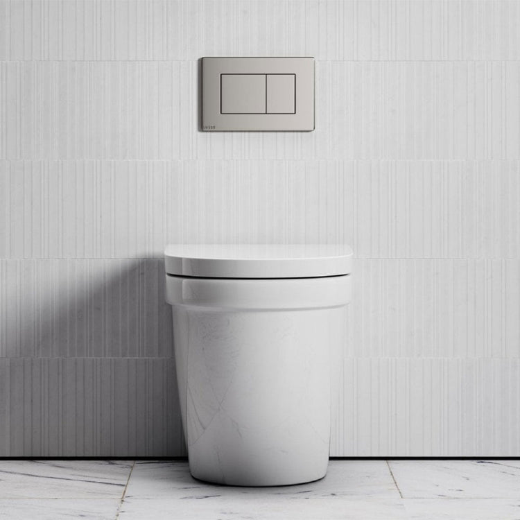 White toilet against a light grey tiled wall