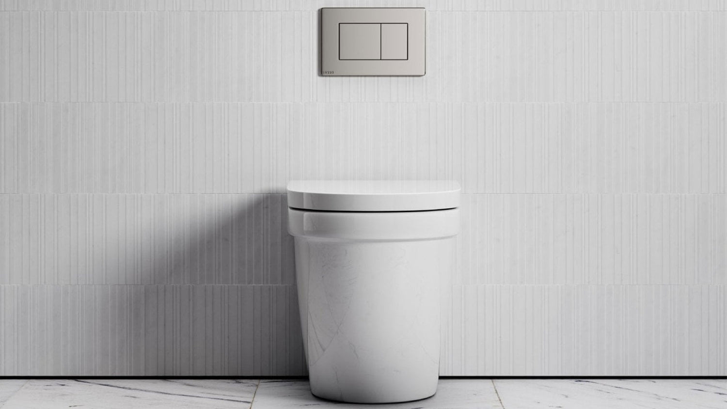 White toilet against a light grey tiled wall