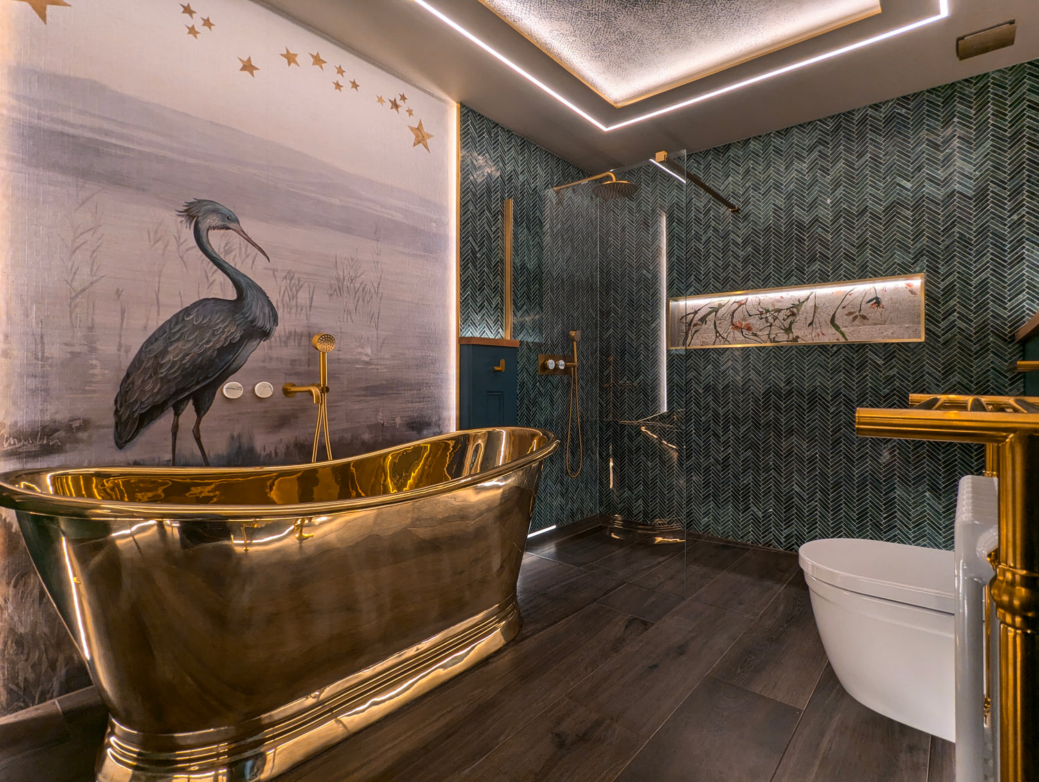 Luxurious bathroom with a gold bathtub and decorative wall art.