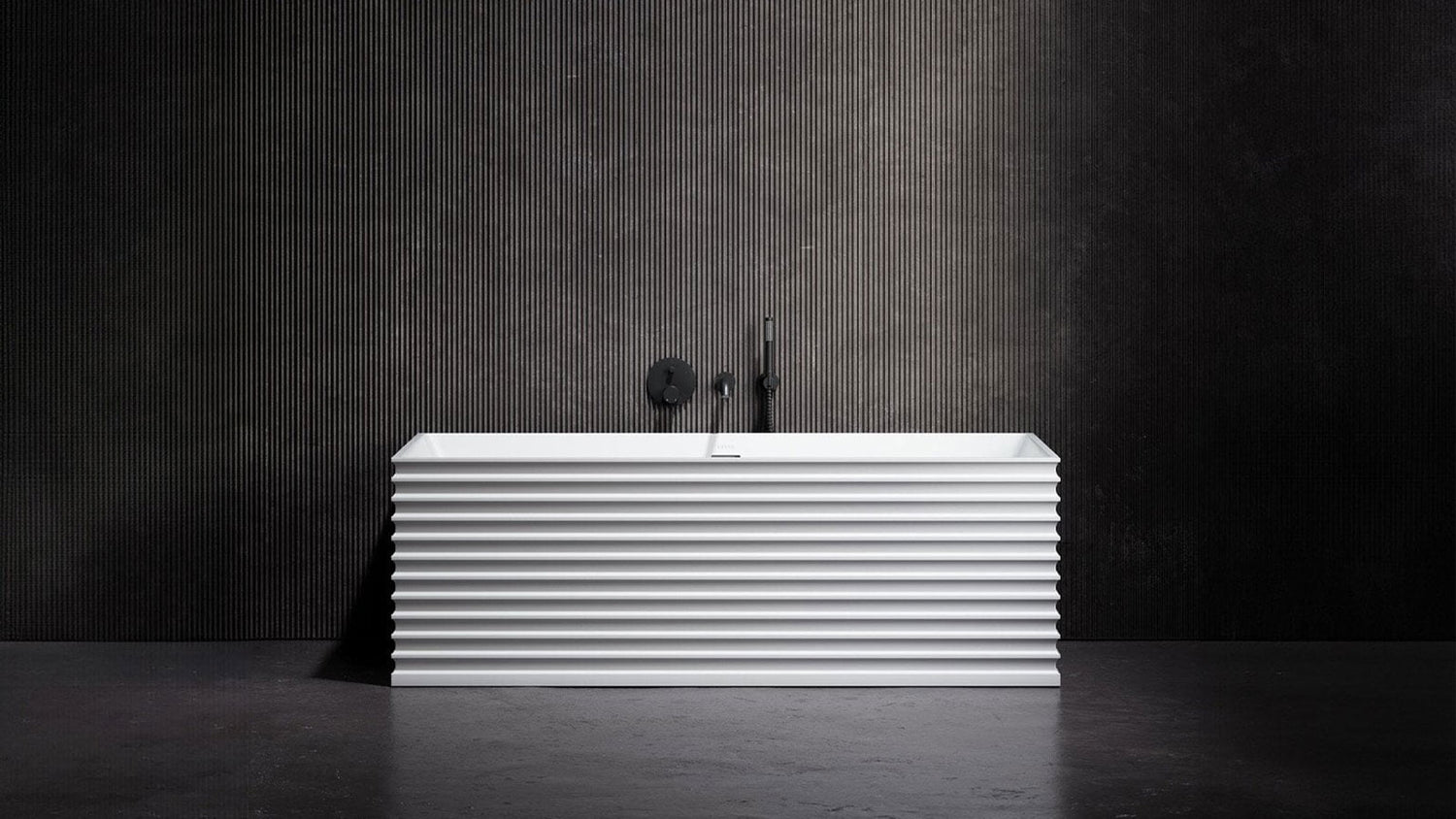 White radiator against a dark textured wall