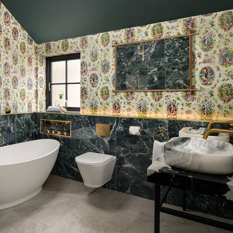 Modern bathroom with floral wallpaper, marble walls, and white fixtures.