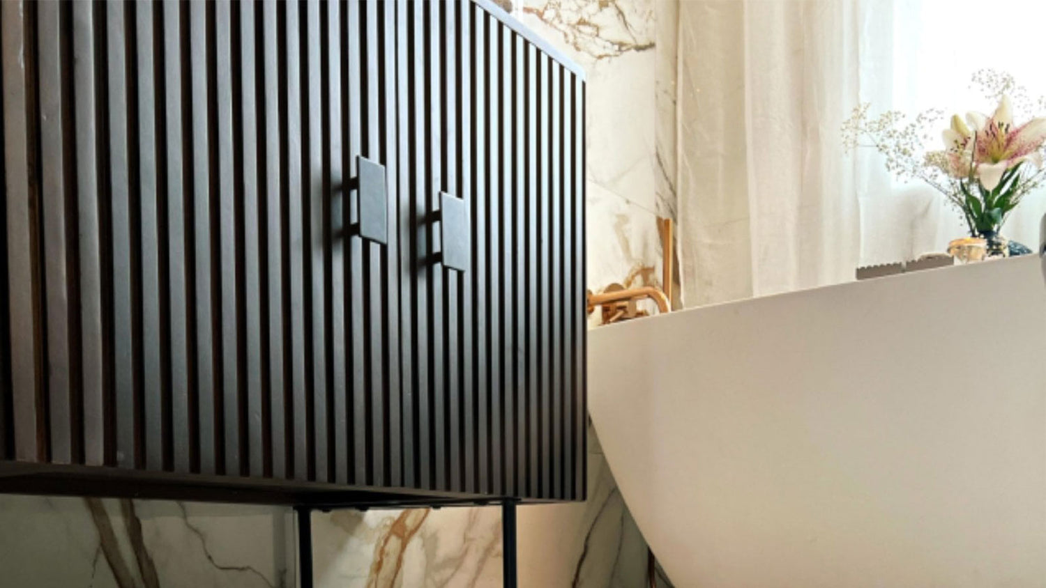 Modern black and white striped cabinet in a room with a table and decorative elements.