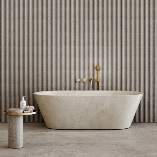 Modern bathroom with a freestanding bathtub against a striped wall.