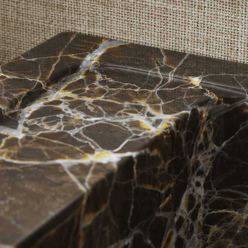 Close-up of a dark marble surface with a textured beige background